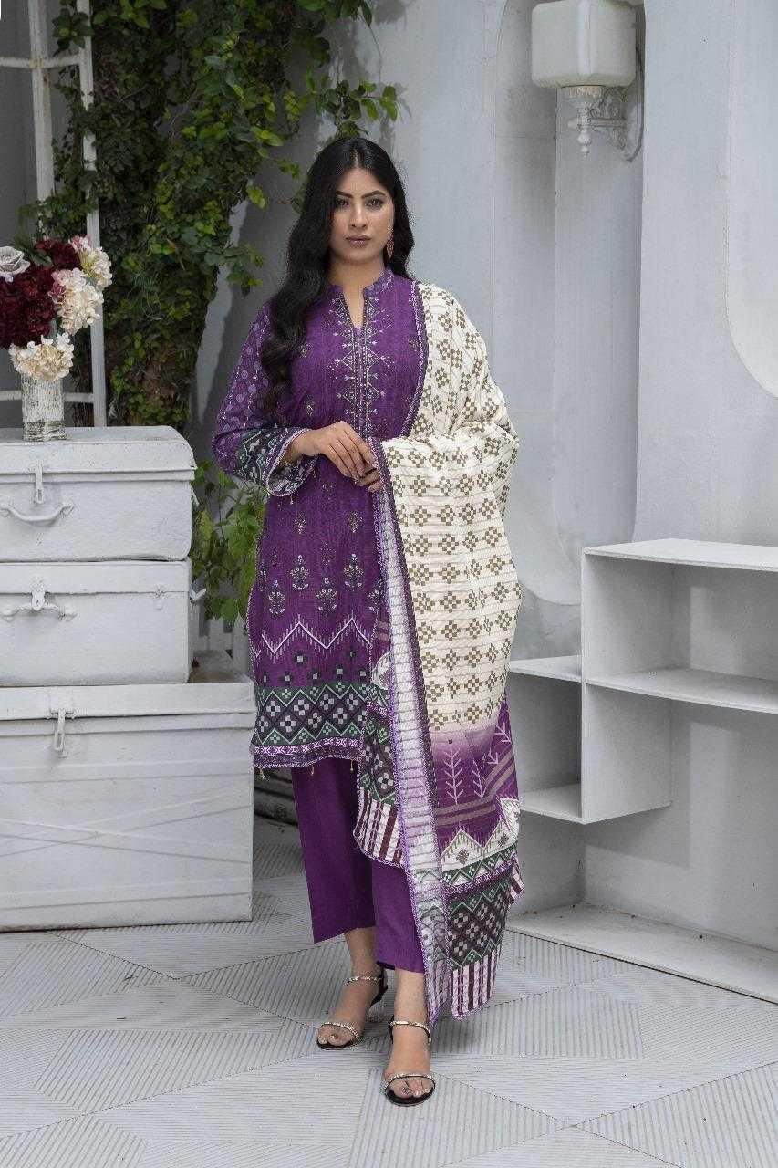 Woman in a purple traditional outfit with a white embroidered dupatta in a minimalistic setting.