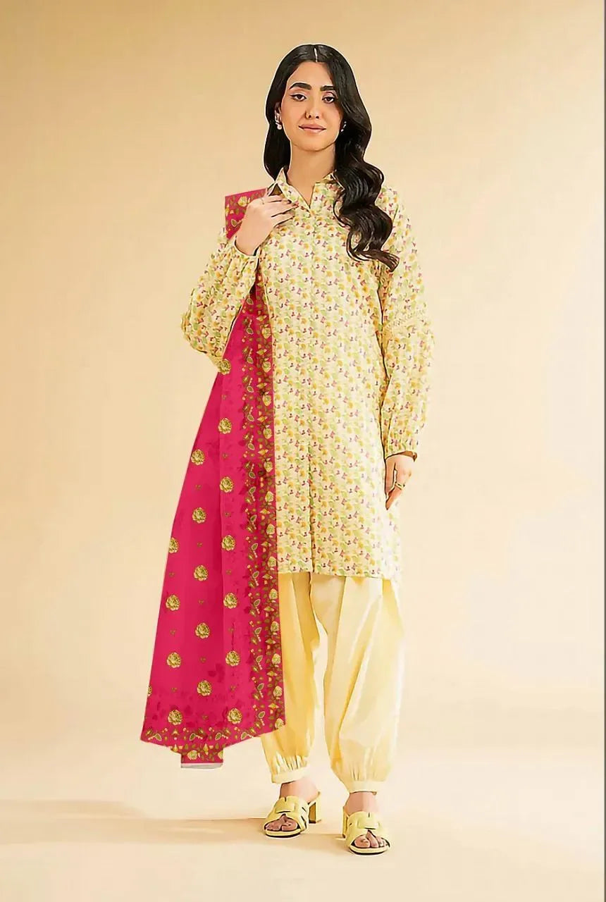 Woman wearing a yellow traditional outfit with a pink dupatta on a beige background