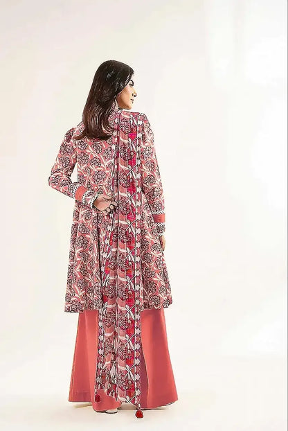 Woman wearing a patterned outfit with a white background