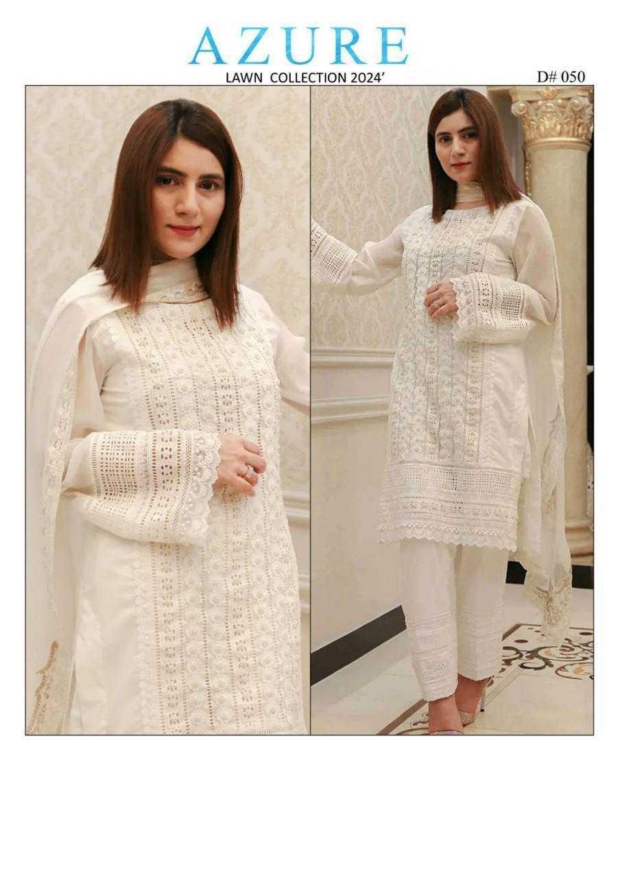 Woman wearing a white outfit with lace details in a room setting, Azure Lawn Collection 2024.