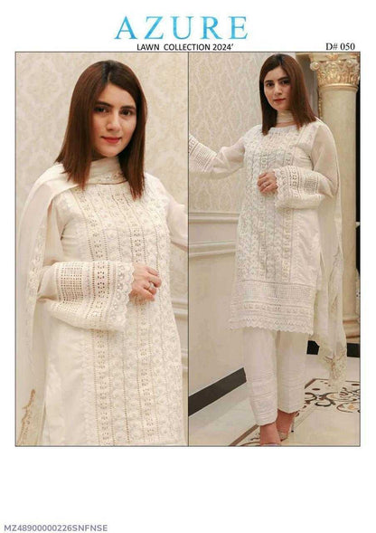 Woman wearing a white outfit with lace details, part of the Azure Lawn Collection 2024.