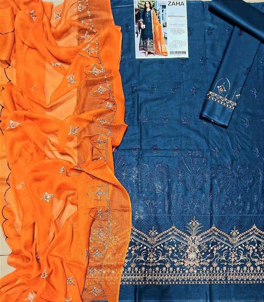 Orange and blue embroidered fabrics with a magazine in the background