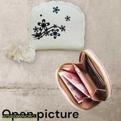 Small white pouch with black floral design and a pink zipper pouch with money on a textured beige surface.