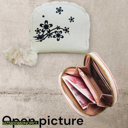 Small white pouch with black floral design and a pink zipper pouch with money on a textured beige surface.