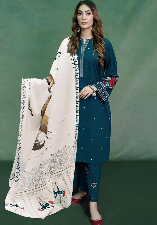 Woman in blue traditional outfit with white embroidered dupatta against a green background