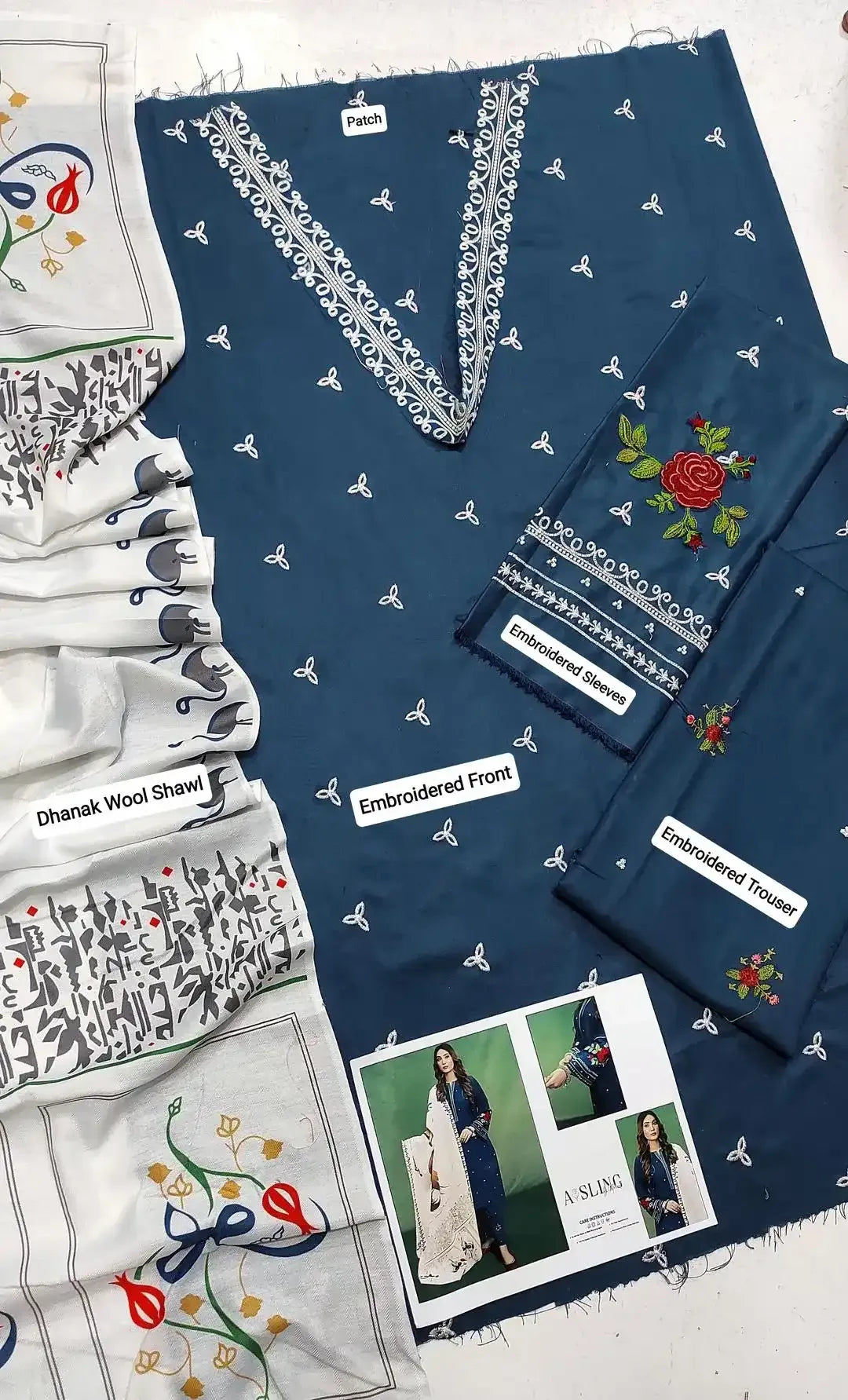 Collection of embroidered clothing and accessories on a white background