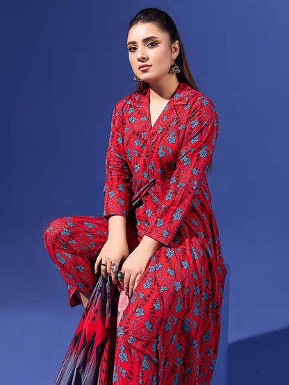 Woman wearing a red floral outfit against a blue background