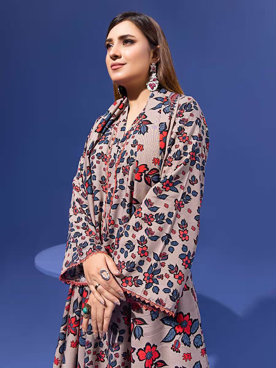 Woman wearing a floral dress against a blue background