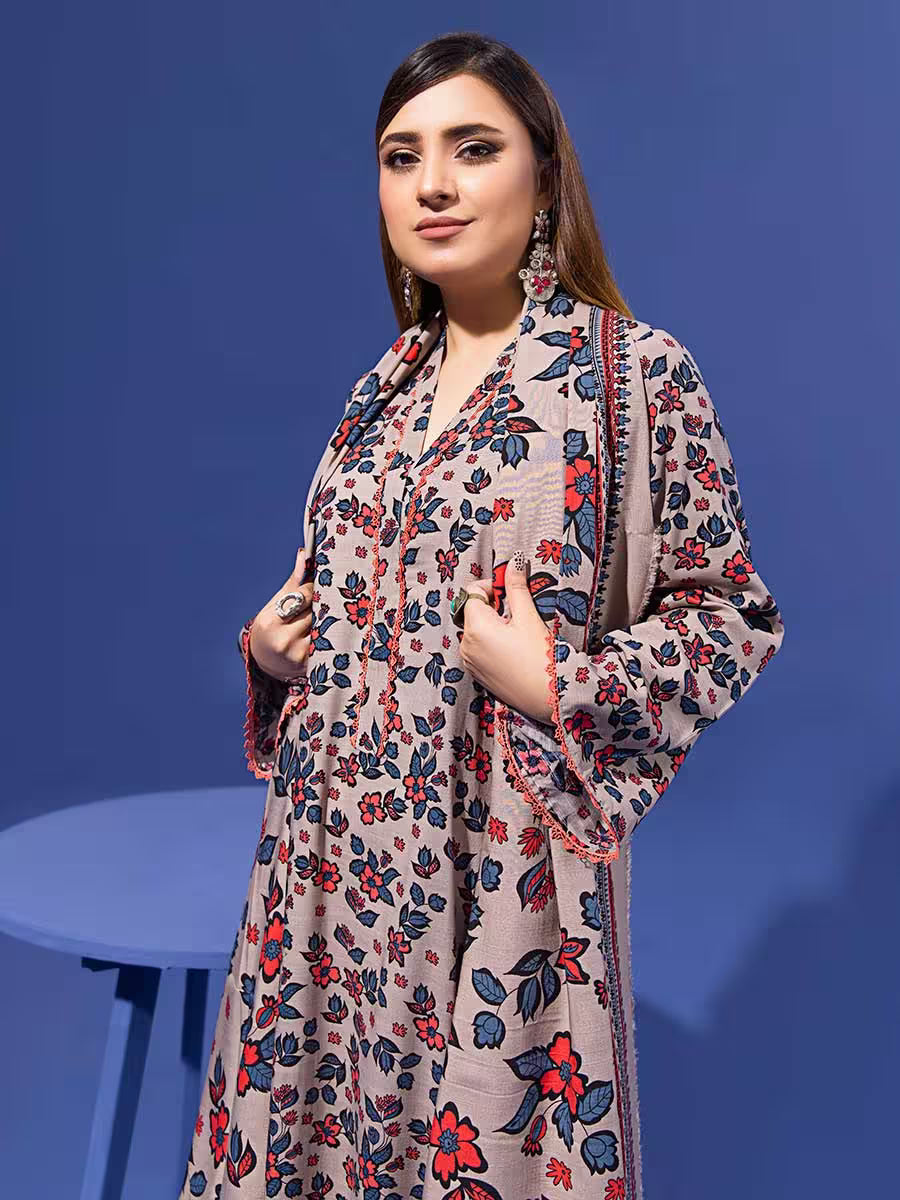 Woman wearing a floral dress against a blue background