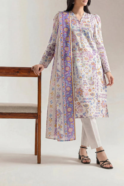 Woman wearing a floral long kurta with white pants on a plain background