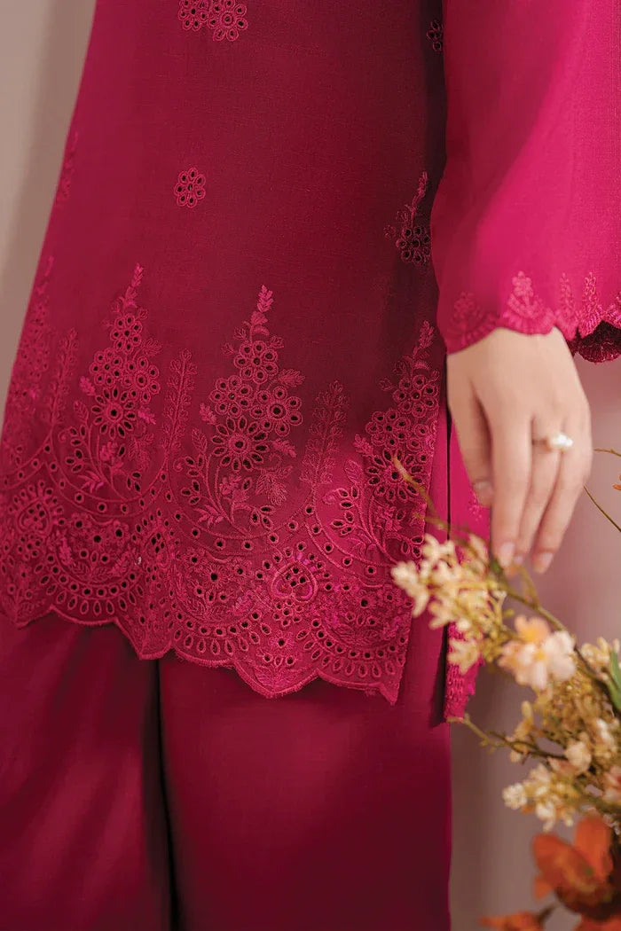 Close-up of a person wearing a red outfit with intricate lace detailing.