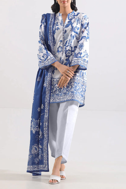 Woman wearing a blue and white patterned outfit with a matching dupatta on a white background