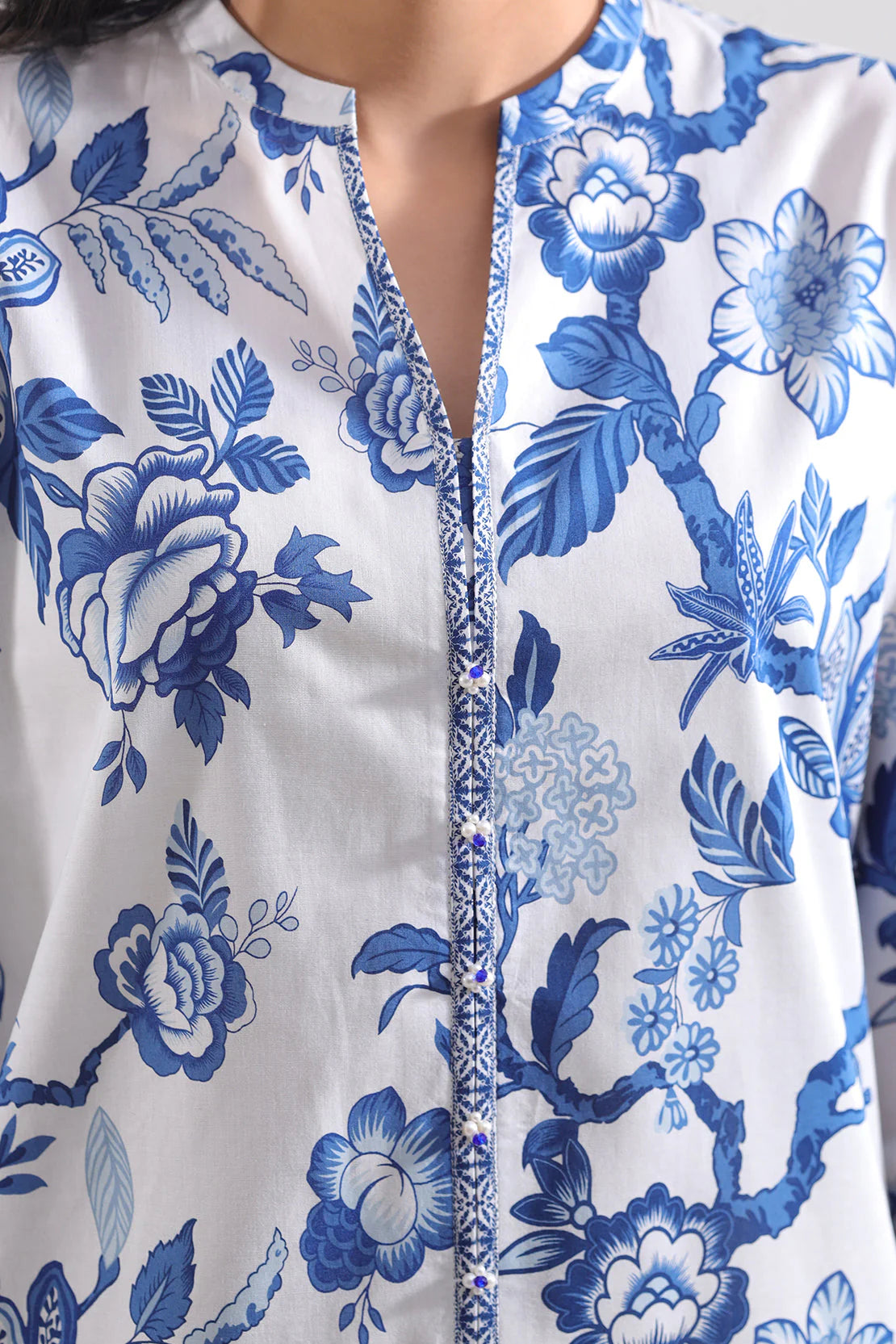 Close-up of a blue floral pattern on a white background