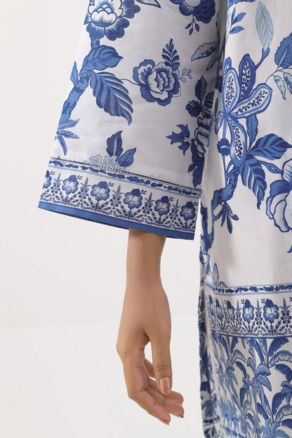 White fabric with blue floral pattern on a plain background