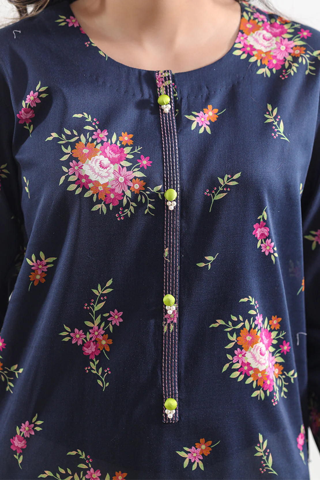 Navy blue top with floral patterns and decorative buttons