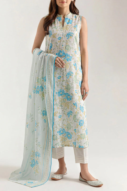 Woman wearing a floral dress with a matching dupatta on a white background