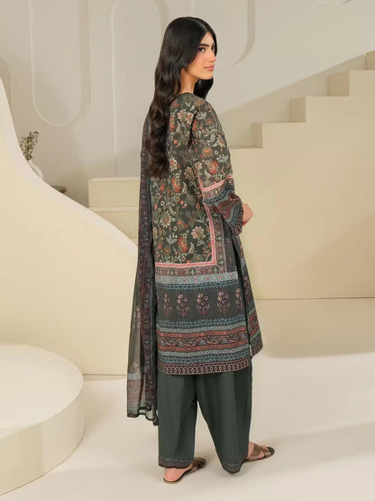 Woman wearing a traditional outfit with floral patterns in a modern indoor setting
