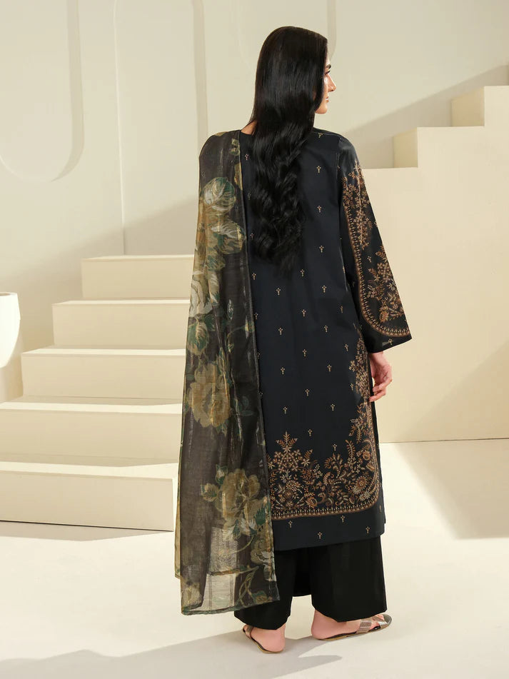 Woman in a black traditional outfit with floral patterns walking up a white staircase.