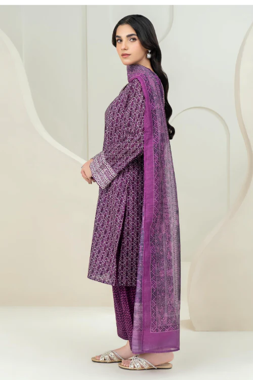 Woman wearing a purple traditional outfit with a matching dupatta against a white background