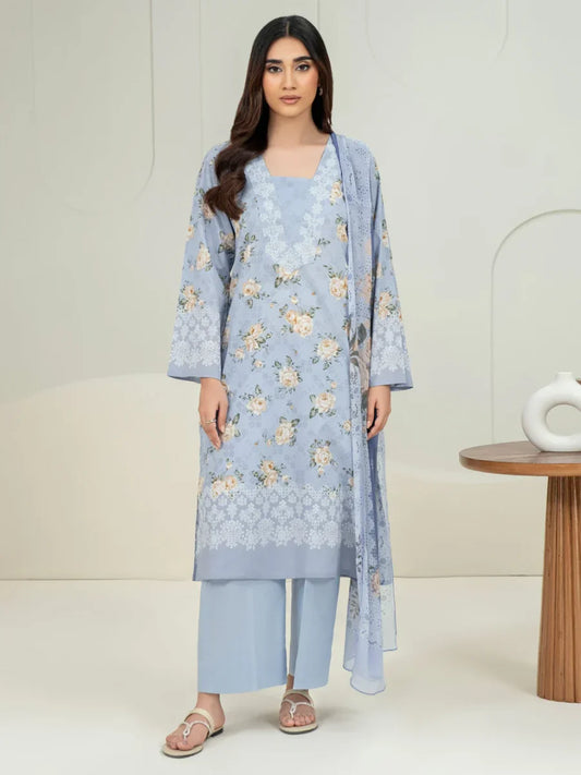 Woman wearing a light blue floral outfit with a white background