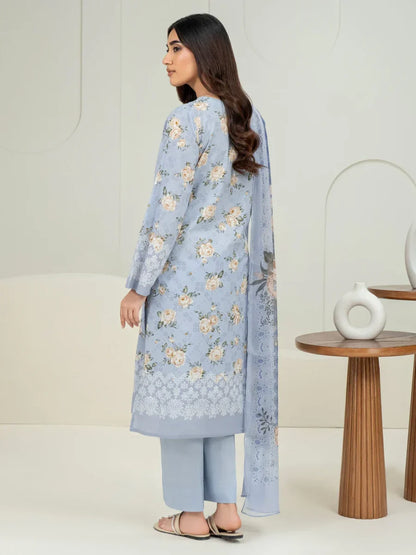 Woman wearing a light blue floral outfit with a white background