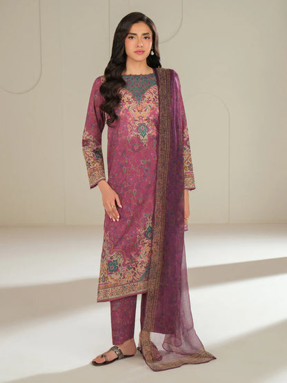 Woman wearing a pink and purple traditional outfit with a matching dupatta on a white background