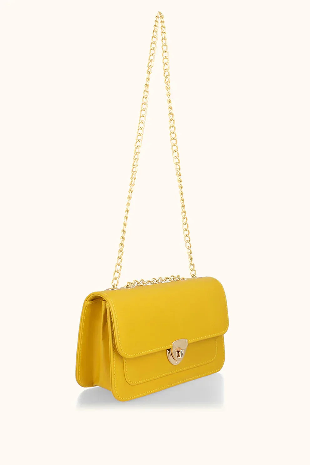 Yellow handbag with a gold chain on a white background