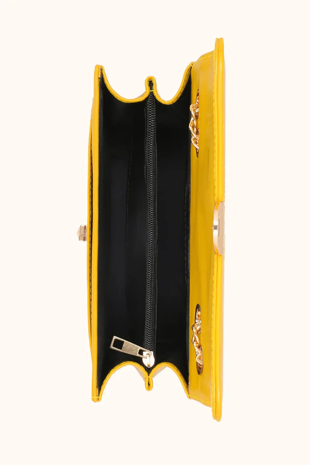Yellow clutch bag with a gold chain on a white background