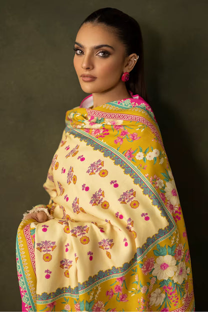 Woman wearing a colorful floral shawl with a dark background