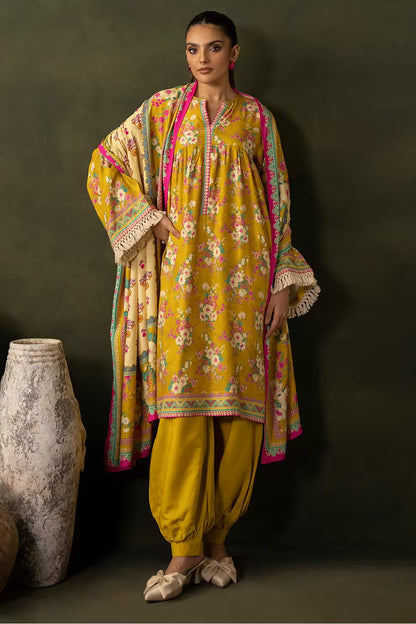 Woman wearing a yellow floral traditional outfit with a dark background