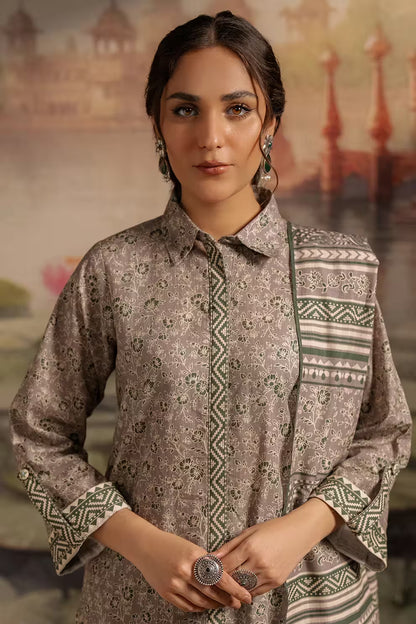 Woman wearing a patterned shirt with a blurred background