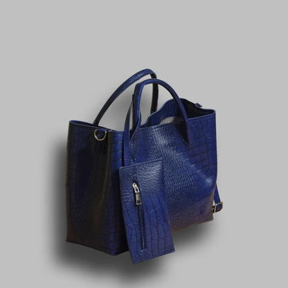 Blue textured handbag on a gray background