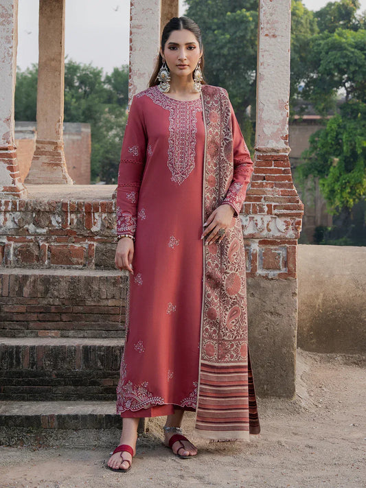 Woman in a traditional outfit standing outdoors with architectural elements in the background