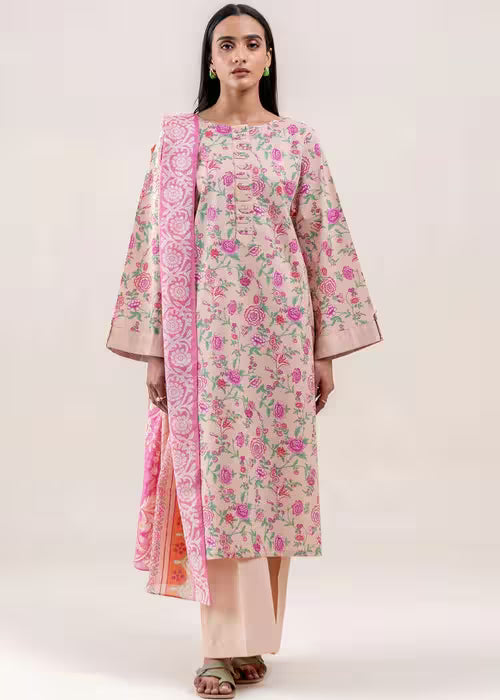 Woman wearing a floral kurta with a matching dupatta on a white background