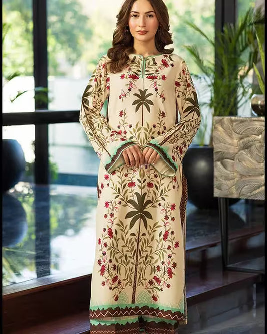 Woman wearing a floral embroidered dress in an indoor setting with plants.