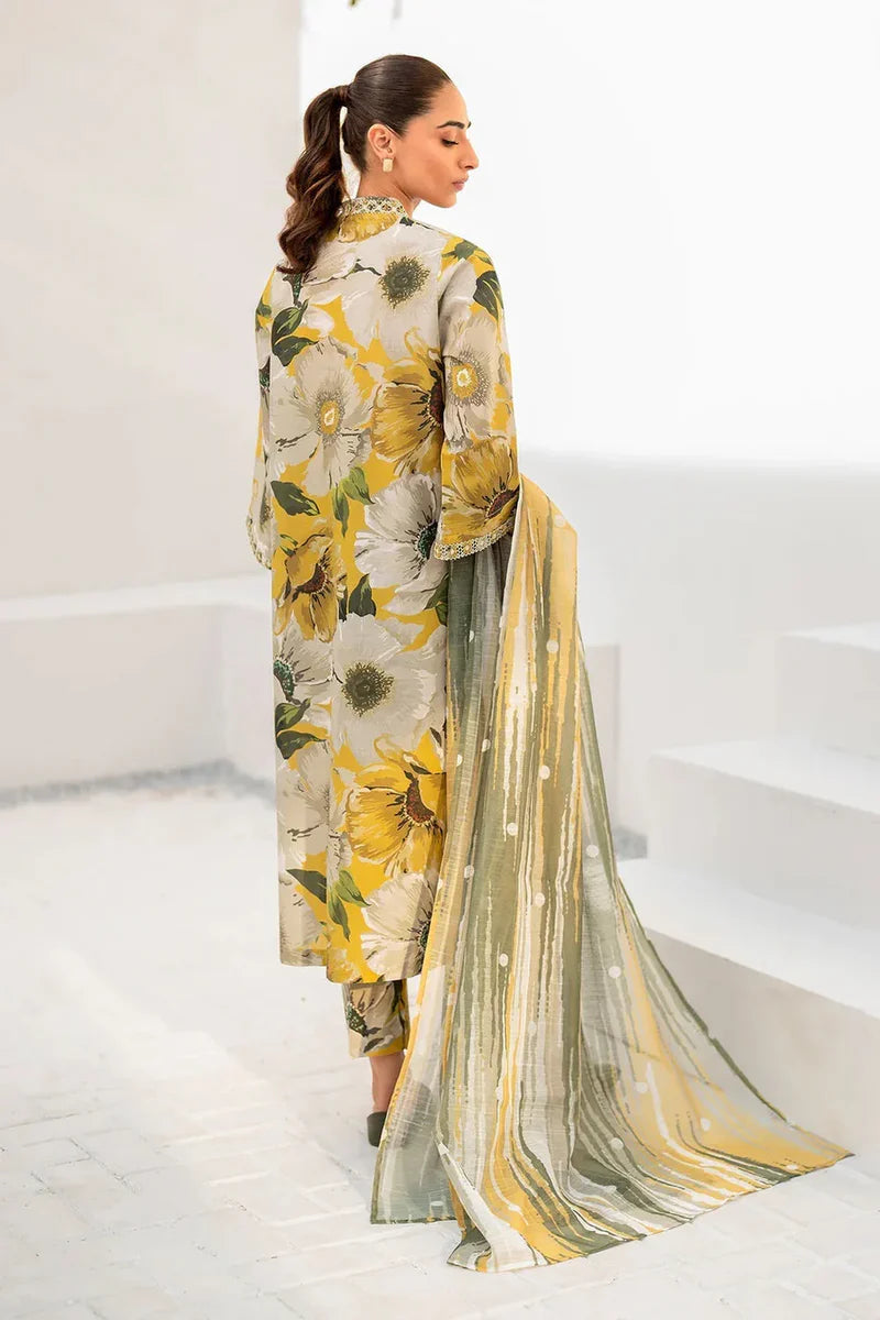Woman wearing a floral dress with a sheer dupatta in a minimalistic setting