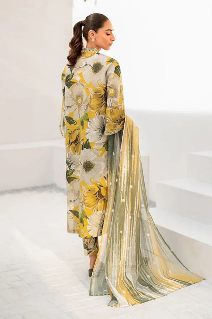 Woman wearing a floral dress with a sheer dupatta in a minimalistic setting