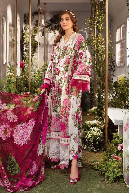 Woman in a floral dress holding a matching shawl in an elegant indoor setting with decorative plants.