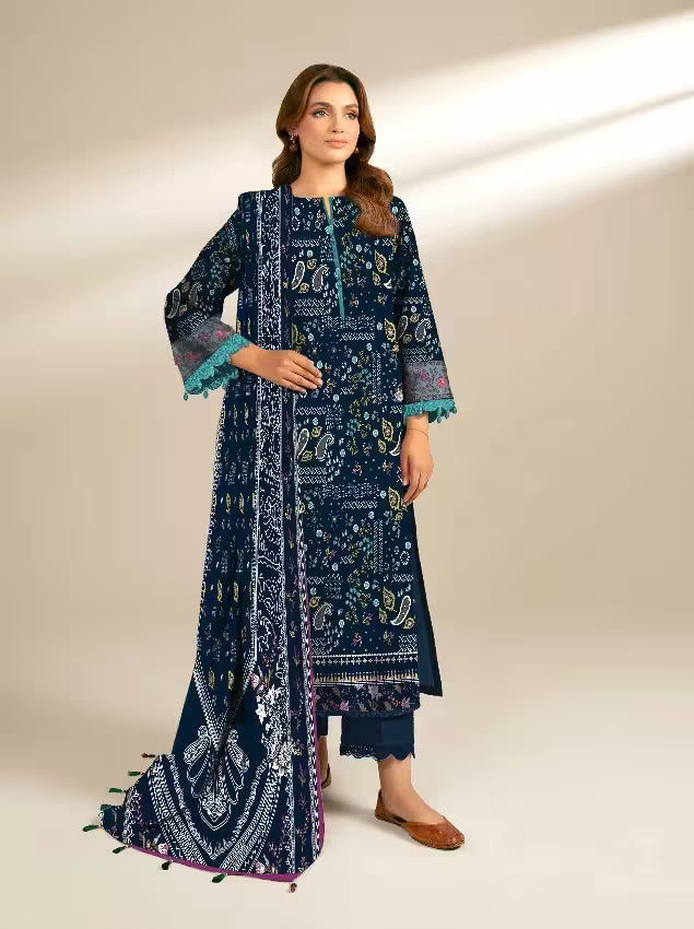 Woman wearing a navy blue embroidered traditional outfit with a matching dupatta on a beige background