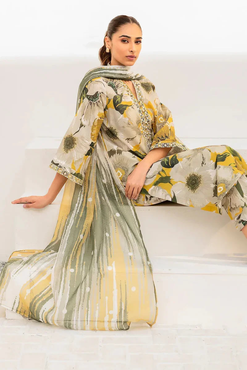 Woman wearing a floral dress with a green dupatta on a white background